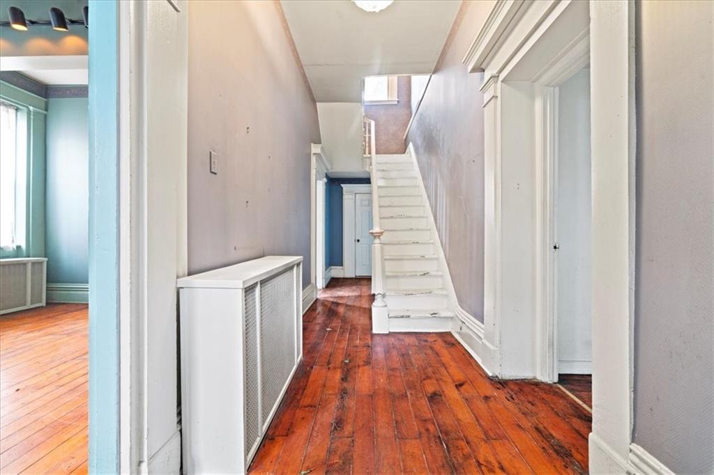 1947 South 18th Street Pittsburgh, PA 15203 - Photo 14 of 48 a view of a hallway with wooden floor and staircase