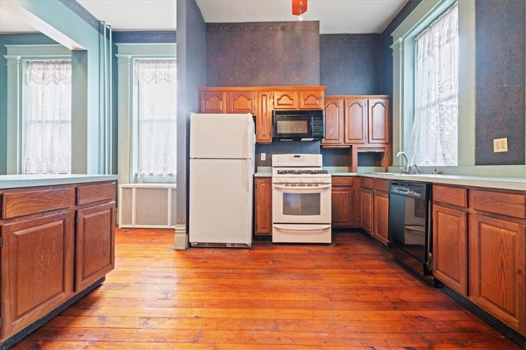 1947 South 18th Street Pittsburgh, PA 15203 - Photo 20 of 48 a kitchen with stainless steel appliances a refrigerator and a stove top oven