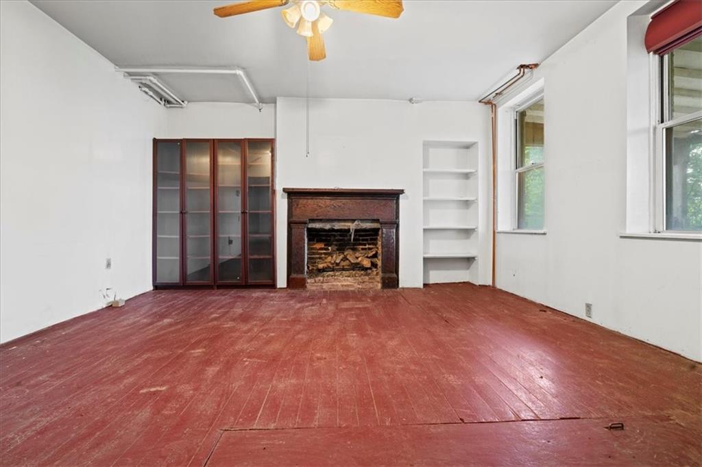 1947 South 18th Street Pittsburgh, PA 15203 - Photo 29 of 48 a view of an empty room with a fireplace and a window