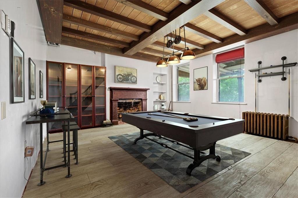 1947 South 18th Street Pittsburgh, PA 15203 - Photo 30 of 48 a living room with furniture a fireplace and a table