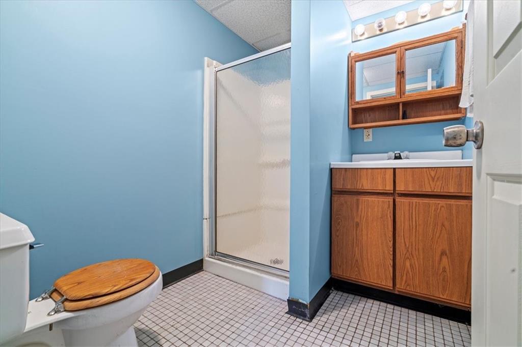 1947 South 18th Street Pittsburgh, PA 15203 - Photo 34 of 48 a bathroom with a toilet a sink and mirror