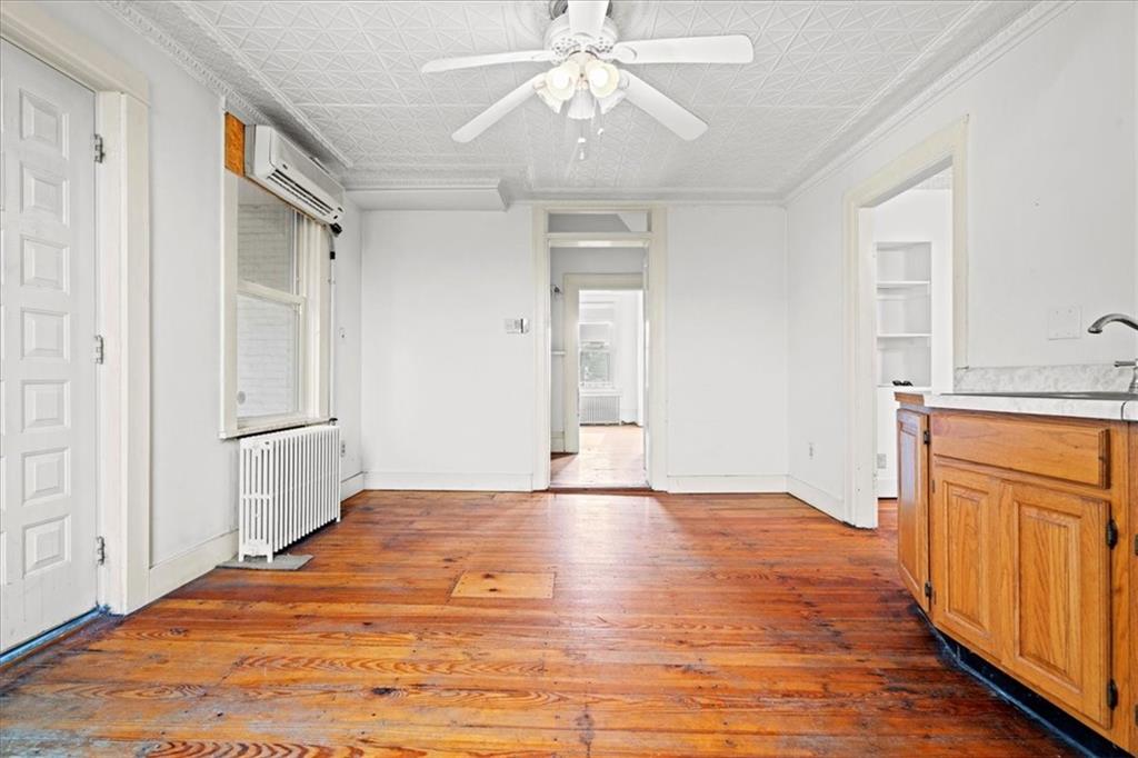 1947 South 18th Street Pittsburgh, PA 15203 - Photo 4 of 48 an empty room with wooden floor cabinet and windows