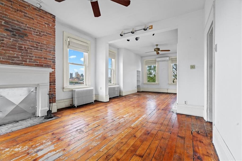 1947 South 18th Street Pittsburgh, PA 15203 - Photo 6 of 48 wooden floor in an empty room with a window