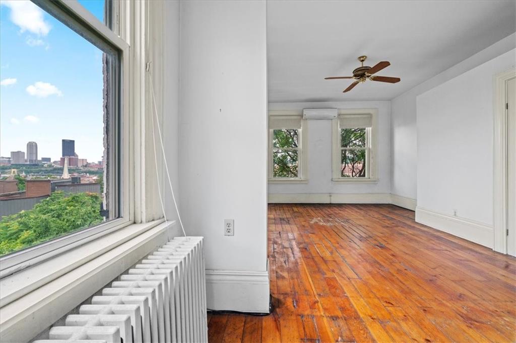 1947 South 18th Street Pittsburgh, PA 15203 - Photo 8 of 48 a view of an entryway with wooden floor and windows