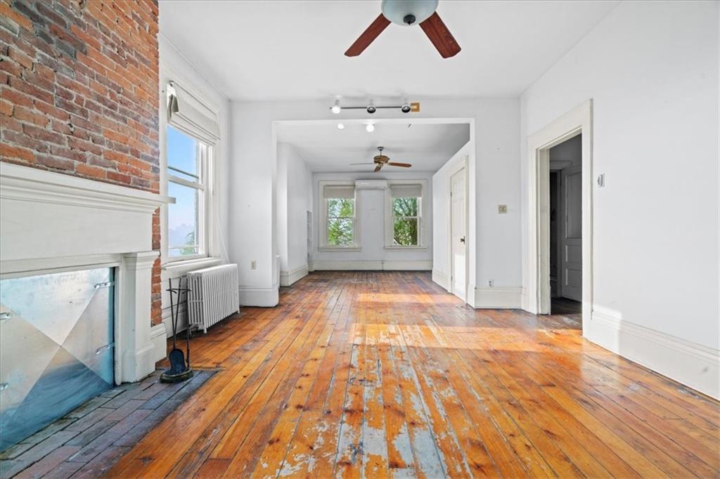1947 South 18th Street Pittsburgh, PA 15203 - Photo 9 of 48 a view of an empty room with window and wooden floor