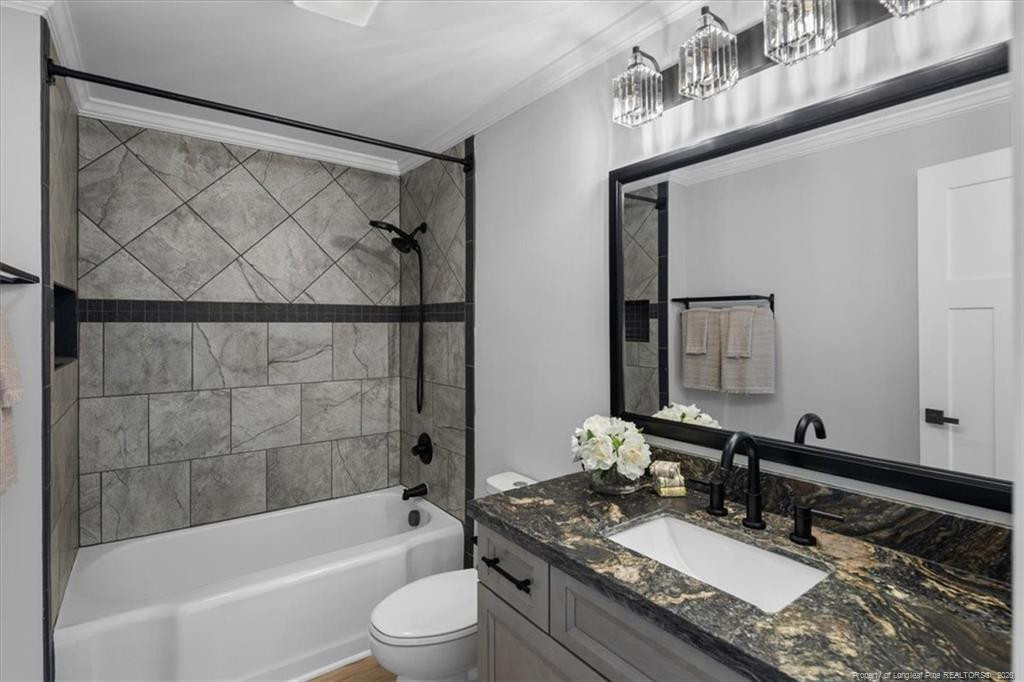 146 Union Church Road Carthage, NC 28327 - Photo 11 of 19 a bathroom with a granite countertop bathtub sink vanity mirror and toilet