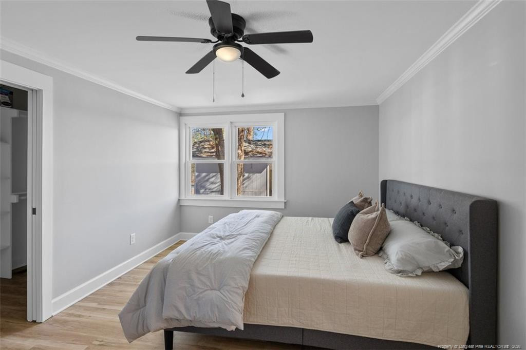 146 Union Church Road Carthage, NC 28327 - Photo 13 of 19 a bedroom with a bed and a window
