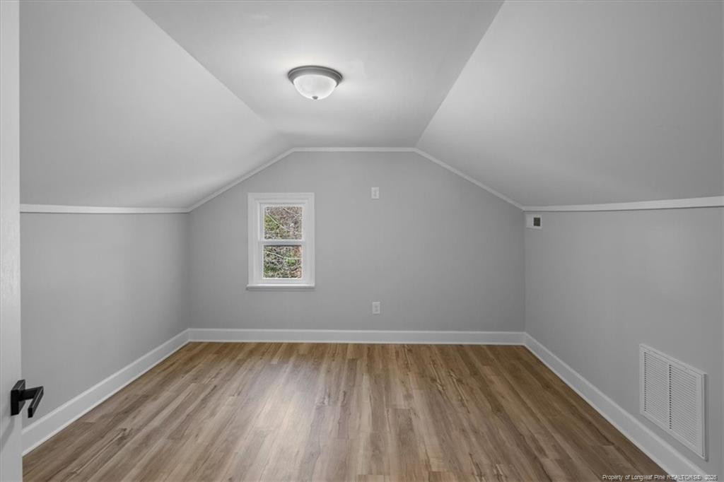 146 Union Church Road Carthage, NC 28327 - Photo 16 of 19 an empty room with wooden floor and windows