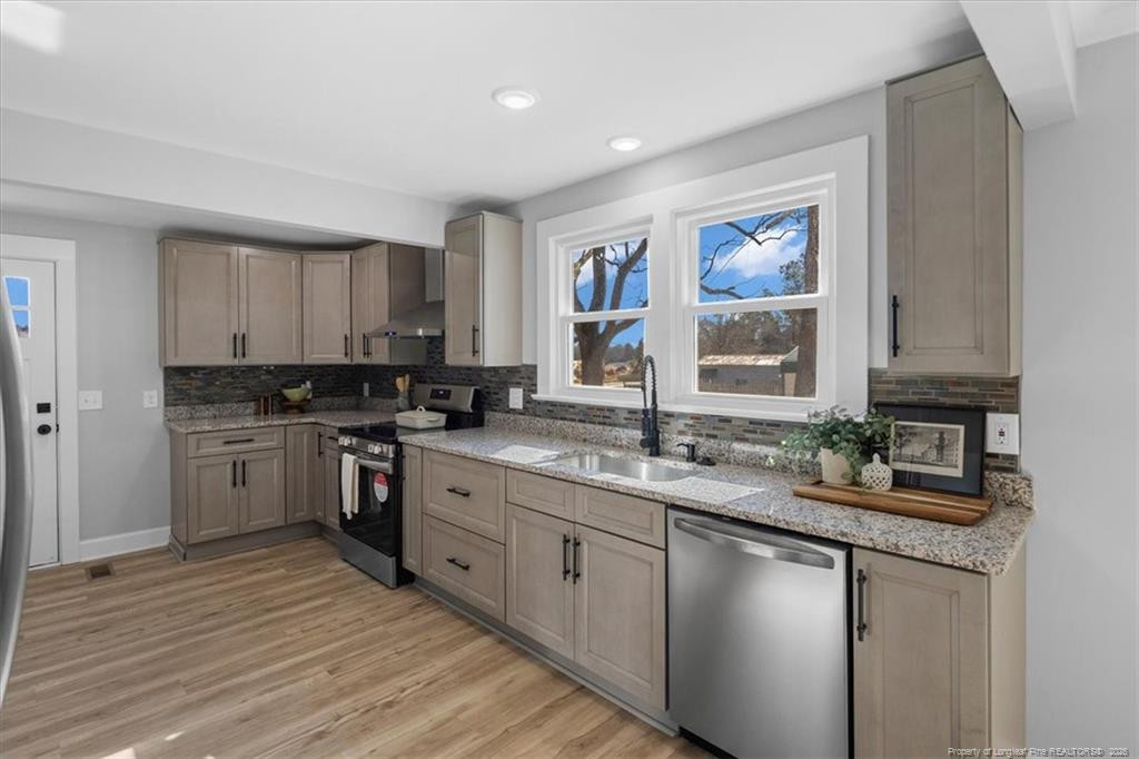 146 Union Church Road Carthage, NC 28327 - Photo 7 of 19 a kitchen with a sink cabinets and window