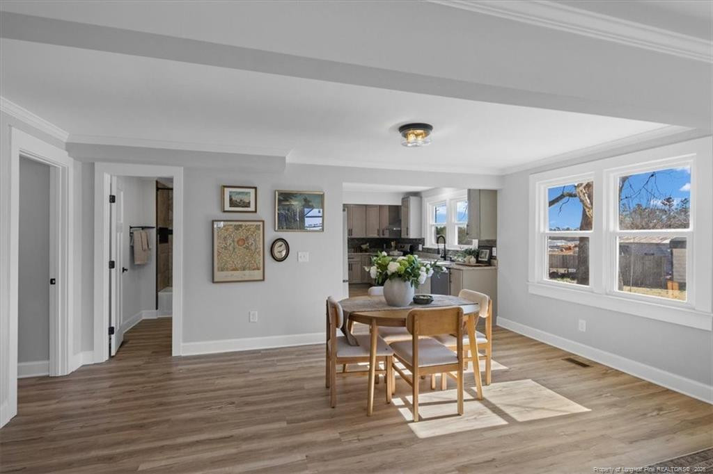 146 Union Church Road Carthage, NC 28327 - Photo 8 of 19 a dining room with wooden floor and window
