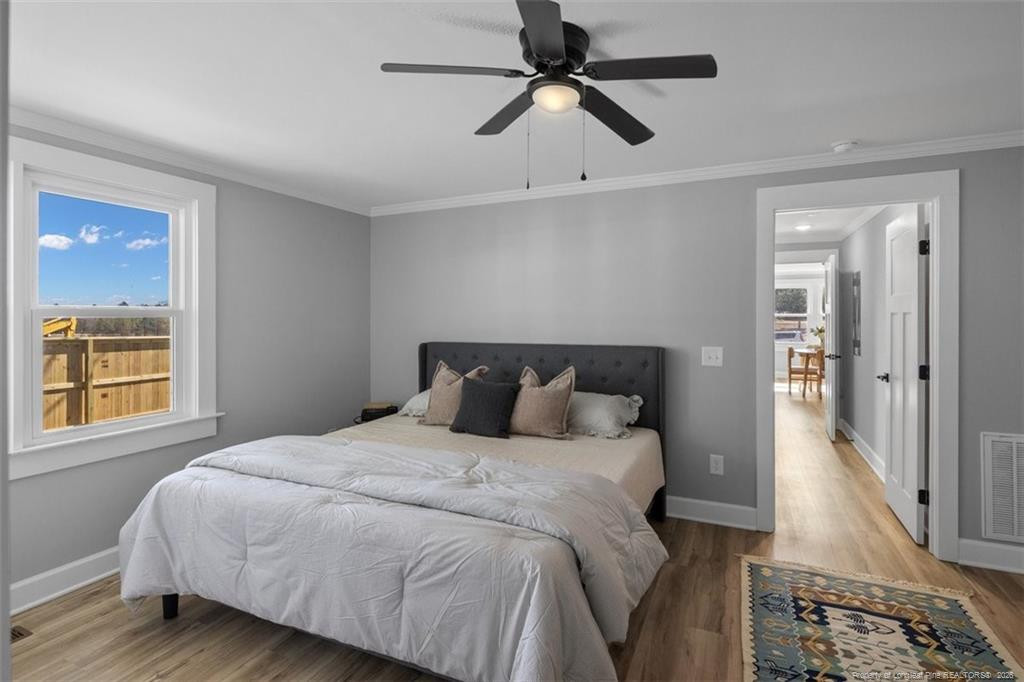 146 Union Church Road Carthage, NC 28327 - Photo 10 of 19 a bedroom with a large bed and a window