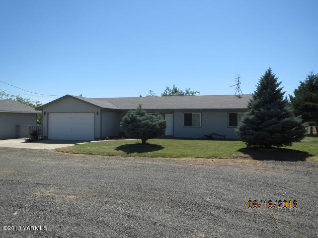 3330 Rosenkranz Road Tieton, WA 98947 - Photo 1 of 15 a front view of a house with a yard and garage