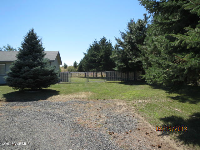 3330 Rosenkranz Road Tieton, WA 98947 - Photo 2 of 15 a view of a field with trees in the background