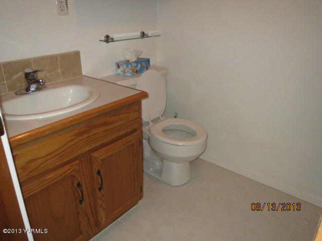 3330 Rosenkranz Road Tieton, WA 98947 - Photo 13 of 15 a bathroom with a sink toilet and a vanity