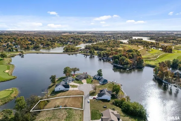 an aerial view of a house with a lake view