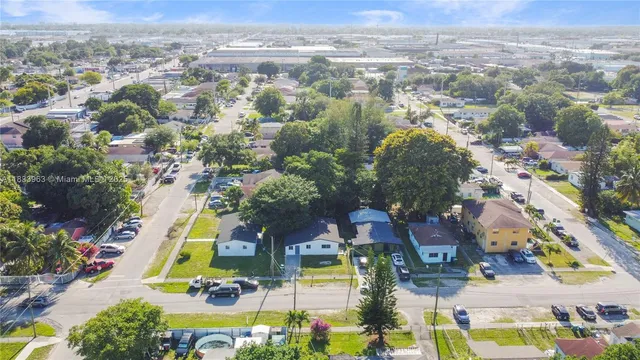 an aerial view of residential houses with outdoor space