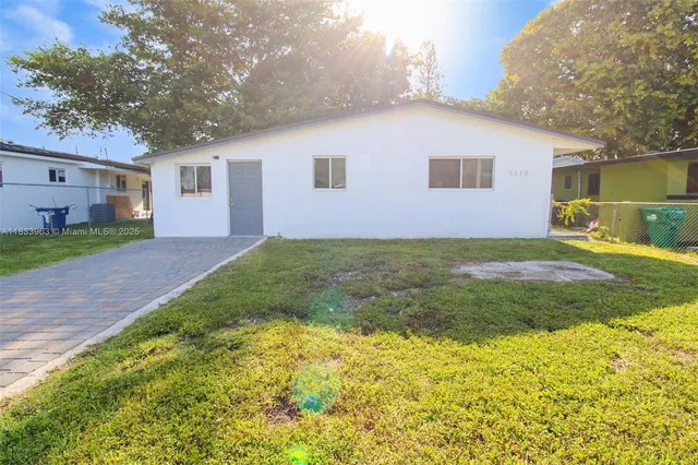 a kitchen with stainless steel appliances a sink stove and cabinets
