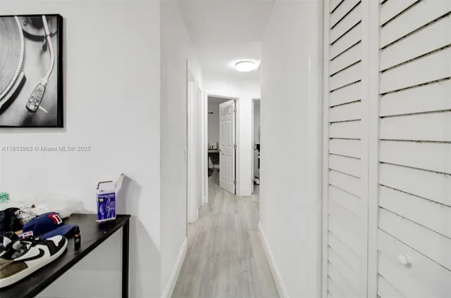 a bathroom with a sink a toilet and shower curtain