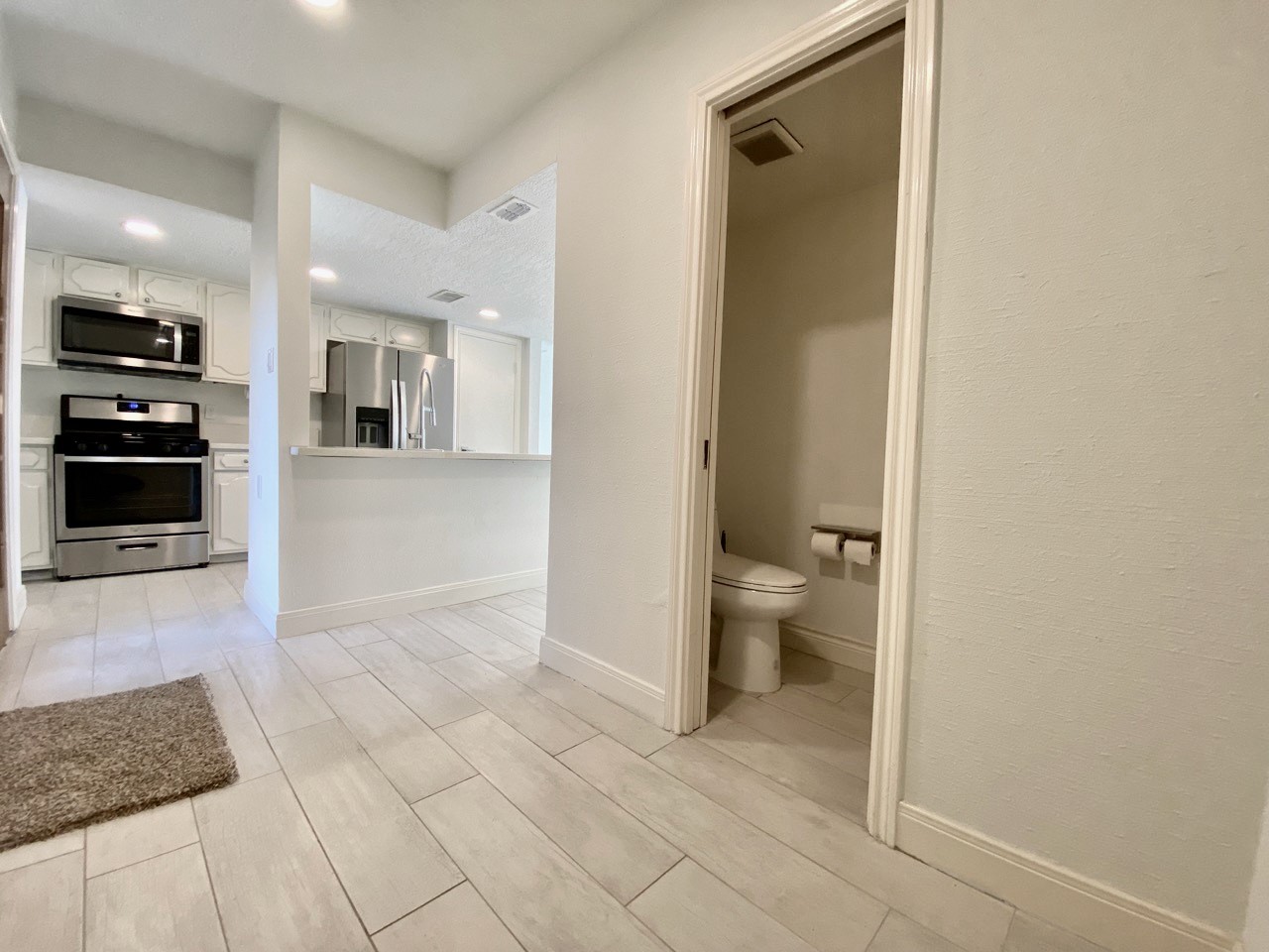 1259 Blalock Road Houston, TX 77055 - Photo 15 of 41 a view of a hallway with bathroom and bathroom