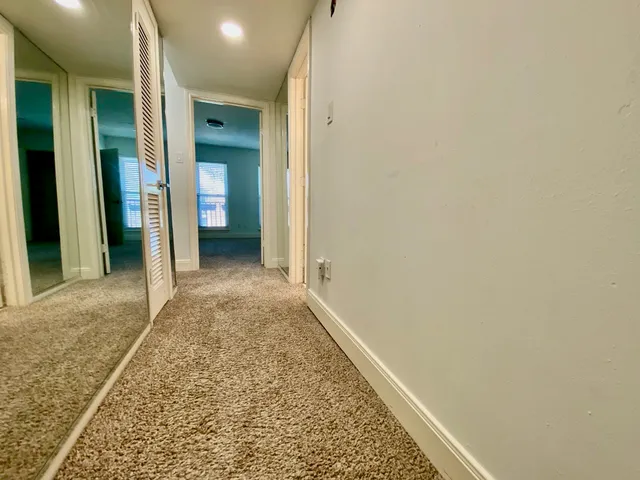 view of a bathroom with a glass shower door