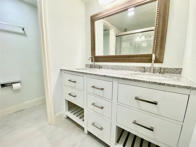 a view of a brick house with many windows