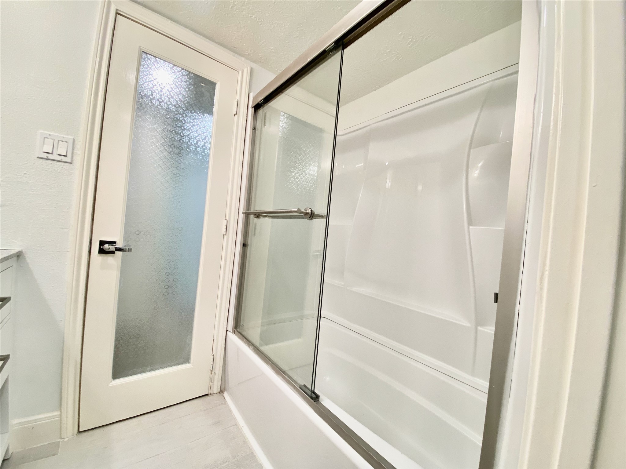 1259 Blalock Road Houston, TX 77055 - Photo 29 of 41 a bathroom with a glass shower door