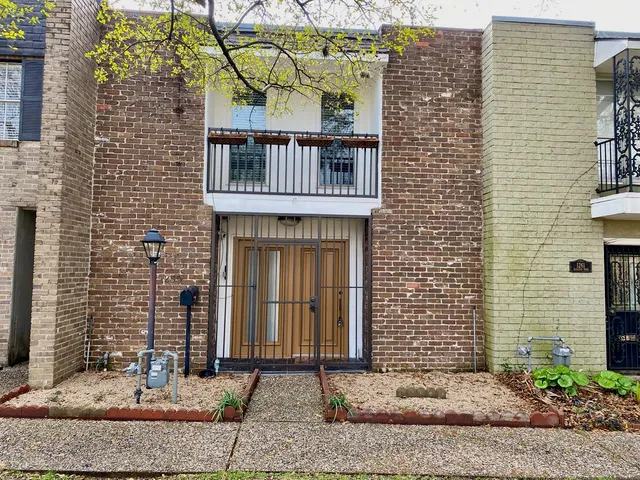 a swimming pool with outdoor seating and yard
