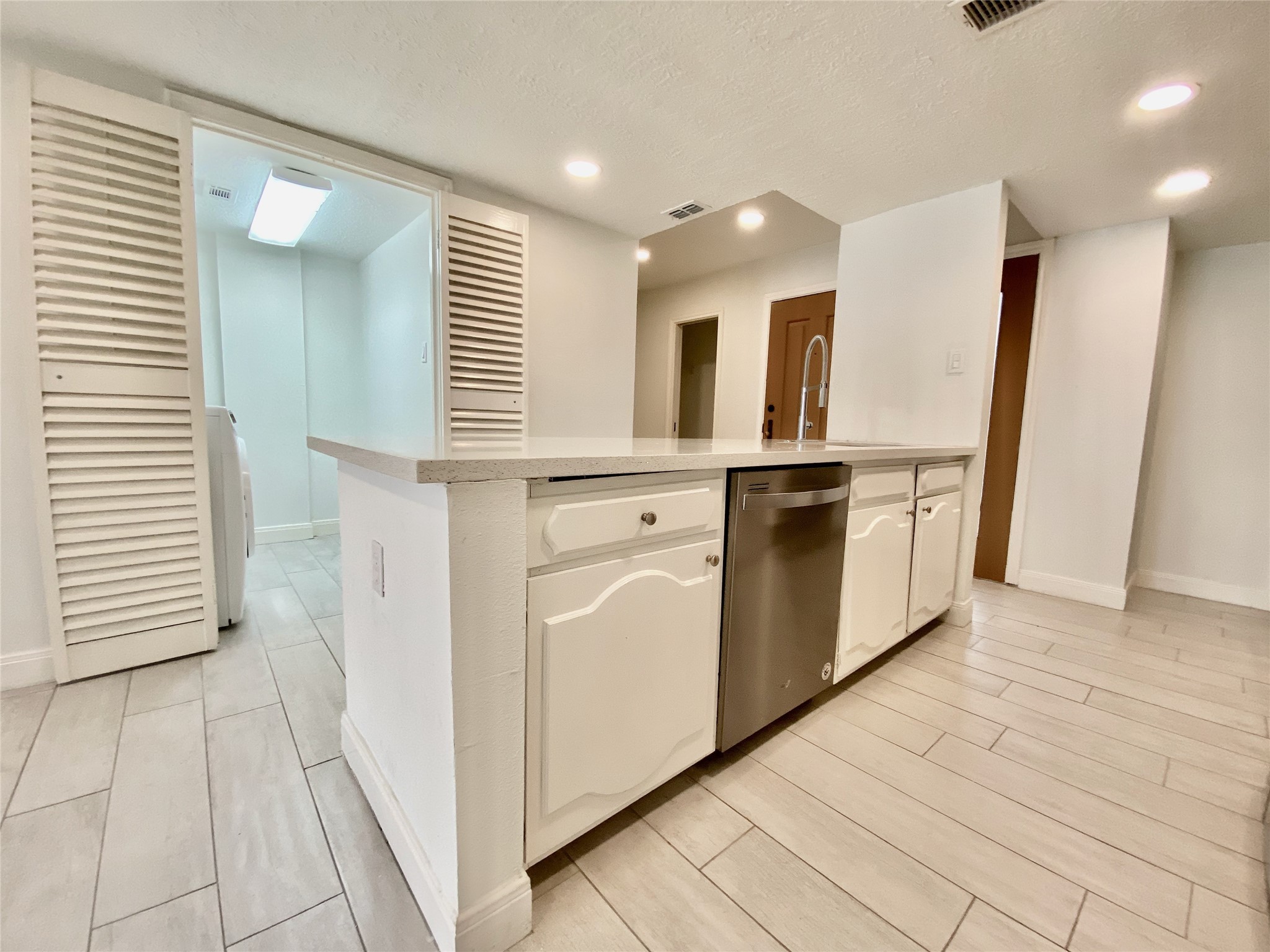 1259 Blalock Road Houston, TX 77055 - Photo 9 of 41 a view of kitchen with stainless steel appliances cabinets and wooden floor