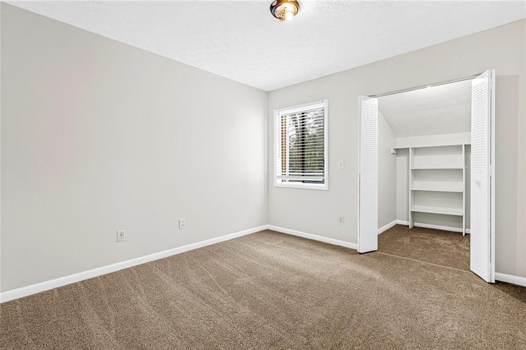 3451 Cobbs Ferry Drive Decatur, GA 30032 - Photo 13 of 21 an empty room with a windows and closet