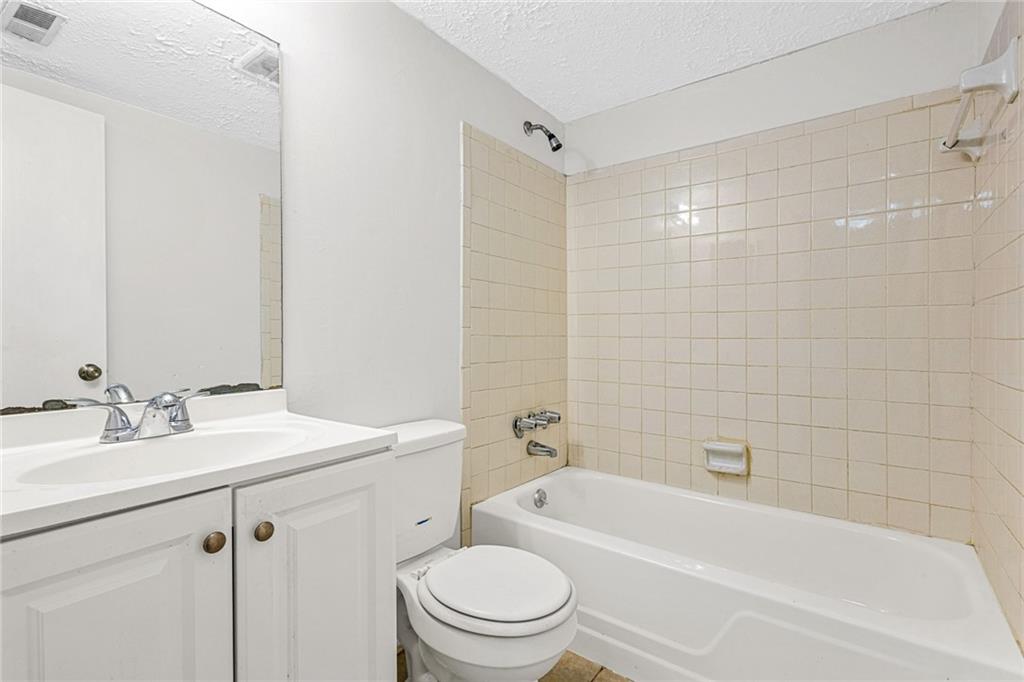 3451 Cobbs Ferry Drive Decatur, GA 30032 - Photo 16 of 21 a bathroom with a sink a toilet and shower