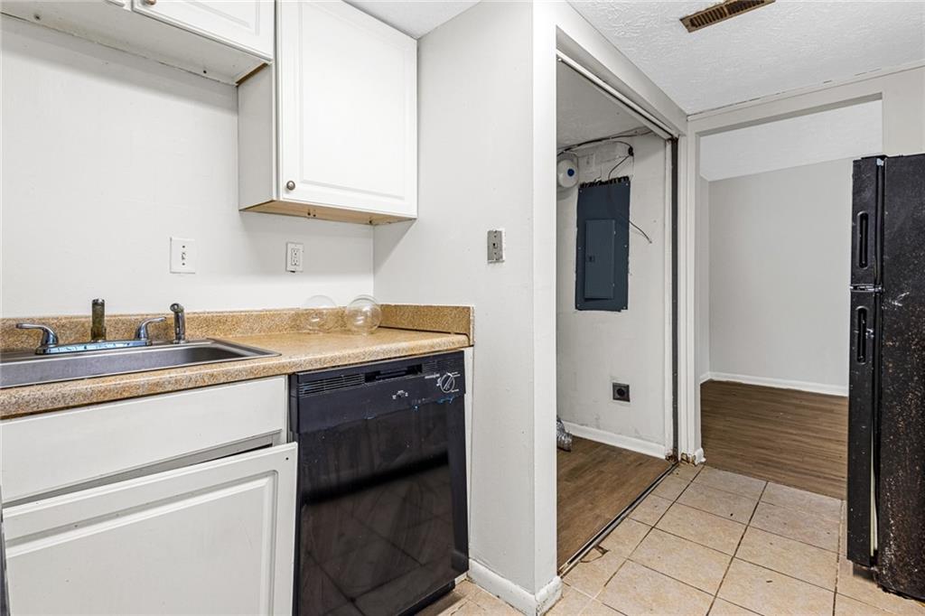 3451 Cobbs Ferry Drive Decatur, GA 30032 - Photo 2 of 21 a kitchen with stainless steel appliances granite countertop a refrigerator and a sink