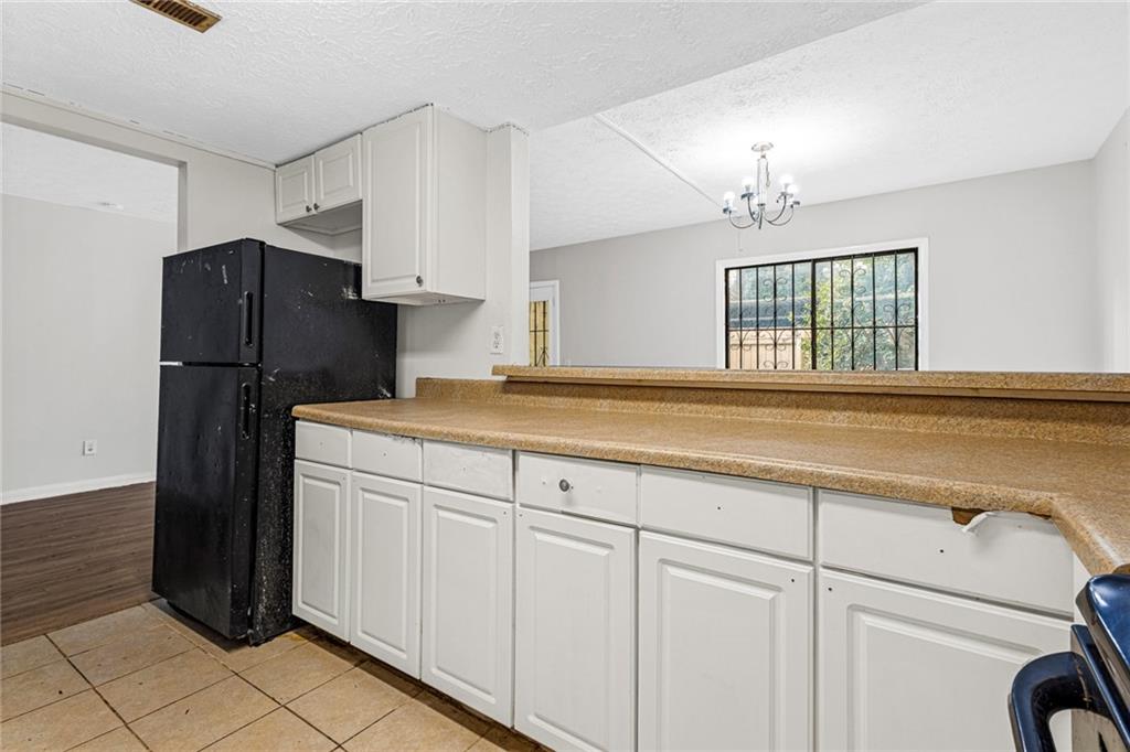 3451 Cobbs Ferry Drive Decatur, GA 30032 - Photo 4 of 21 a kitchen with a refrigerator and cabinets