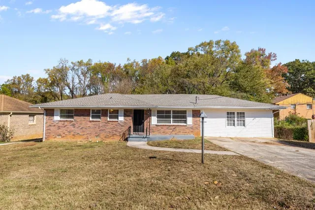 front view of a house with a yard