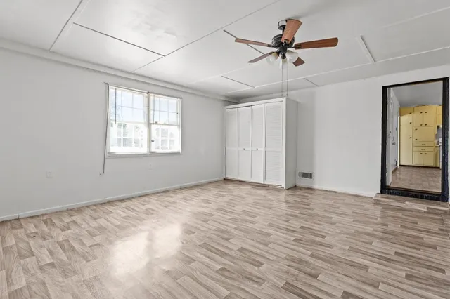 a view of an empty room with a window