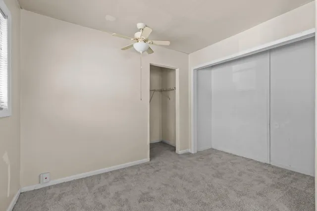 an empty room with a view of a bathroom