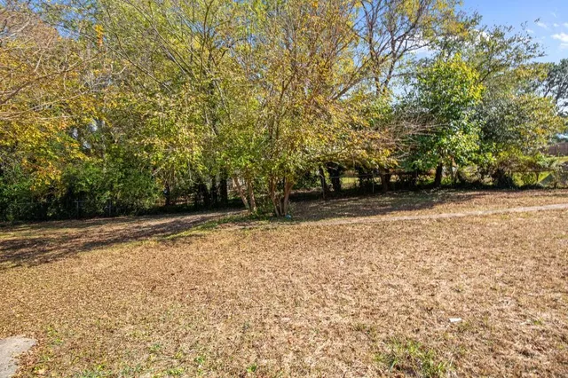 a view of outdoor space with deck and yard