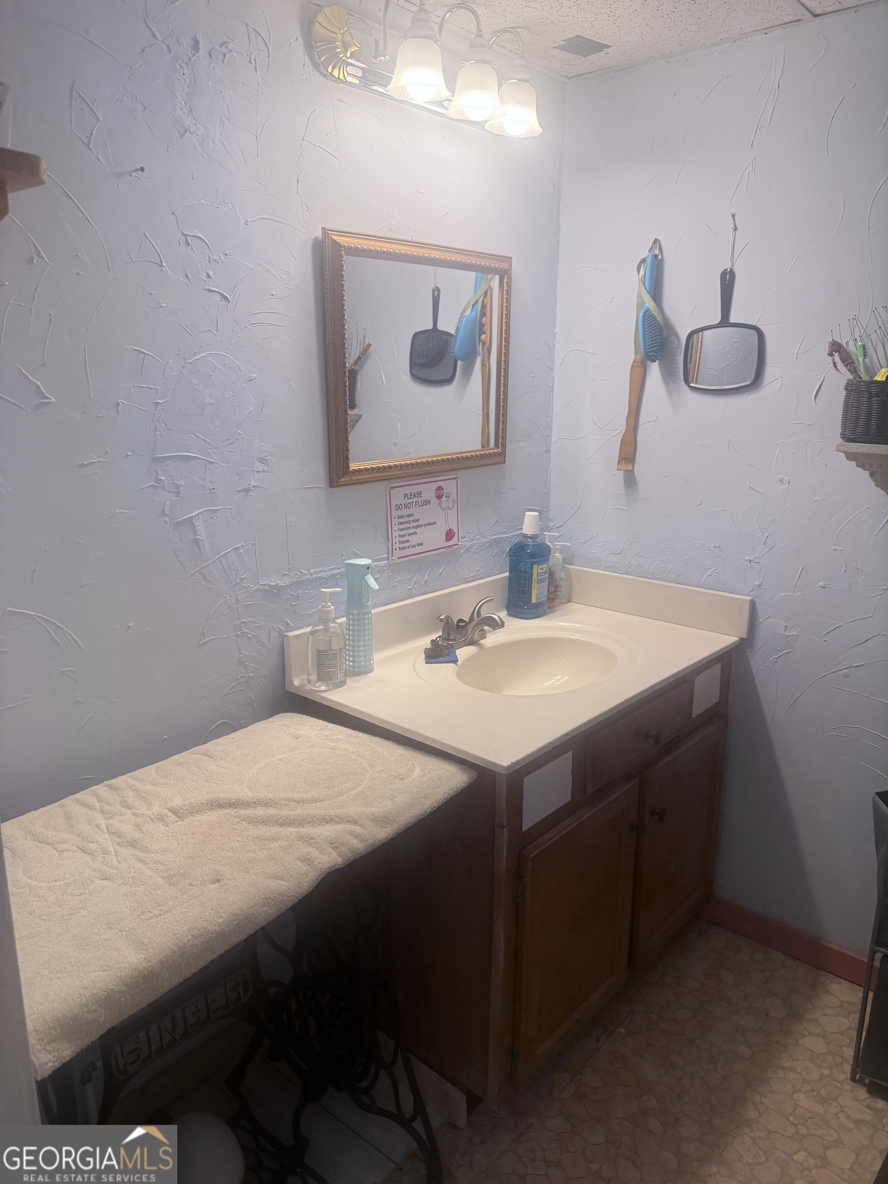 1072 Mountain View Road Trion, GA 30753 - Photo 14 of 29 a en suite bathroom with a sink vanity and a mirror