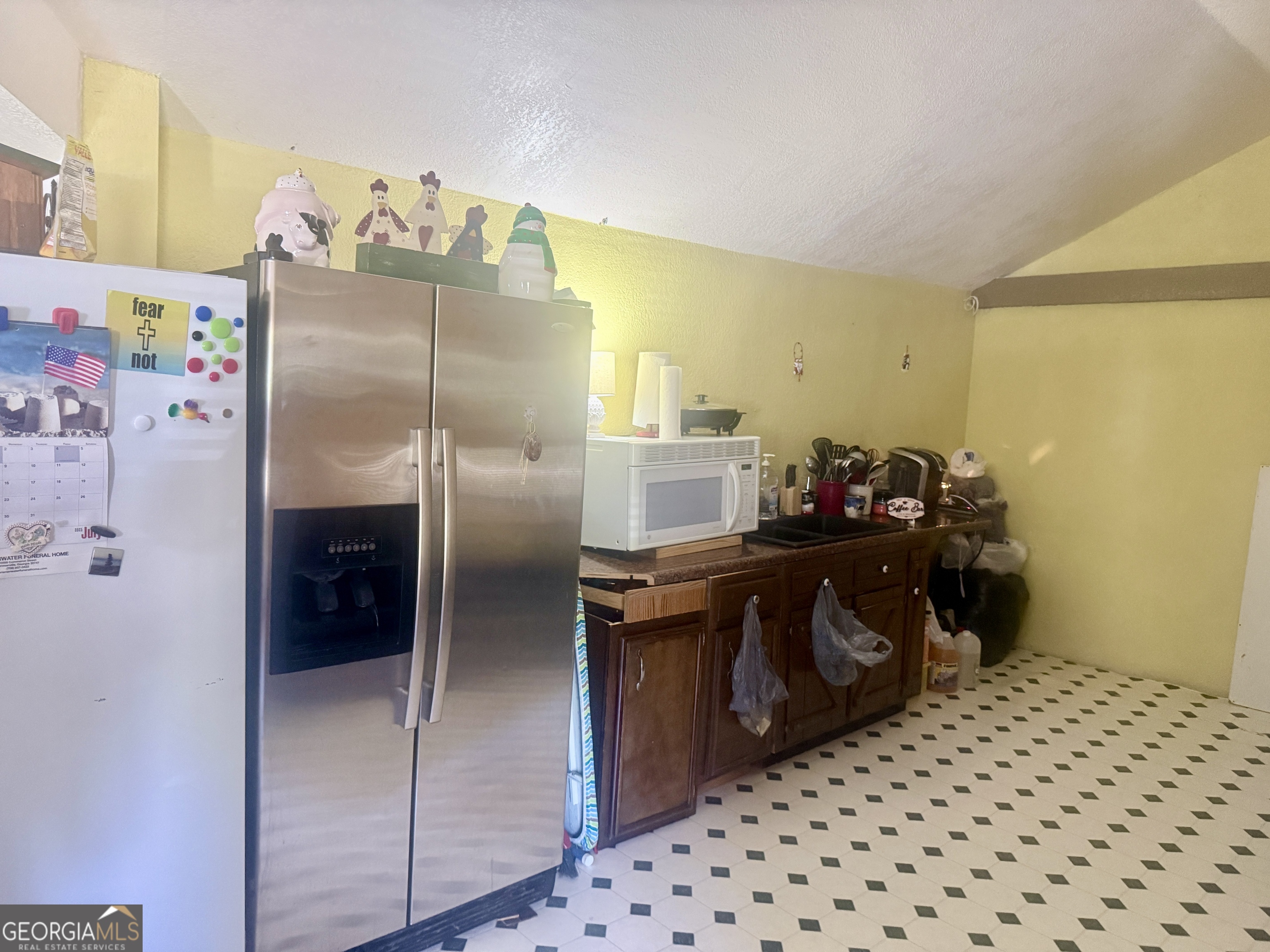 1072 Mountain View Road Trion, GA 30753 - Photo 27 of 29 a kitchen with a refrigerator and cabinets