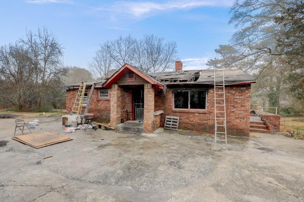2636 Old Toney Road Ellenwood, GA 30294 - Photo 12 of 16 a view of a house with a yard and sitting area