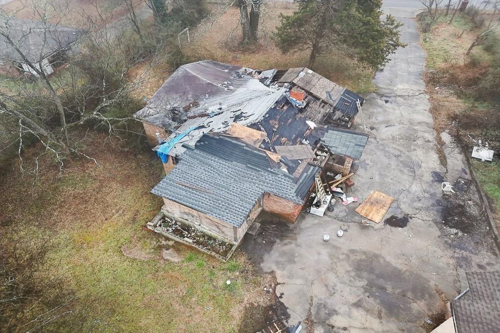 2636 Old Toney Road Ellenwood, GA 30294 - Photo 6 of 16 a view of a backyard with chair and a fire pit