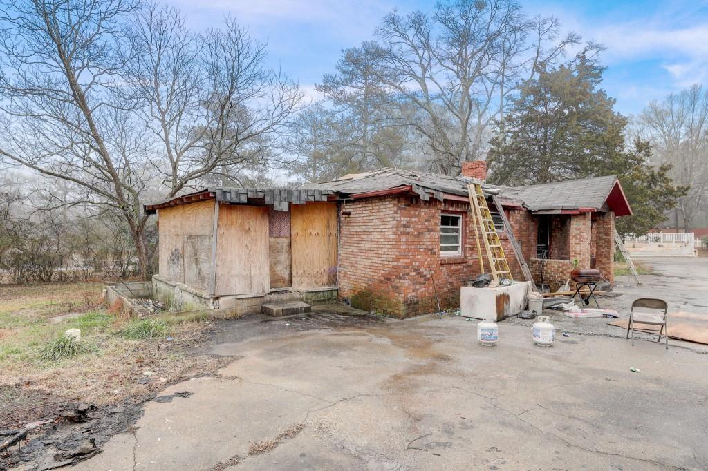 2636 Old Toney Road Ellenwood, GA 30294 - Photo 9 of 16 a front view of a house with garden