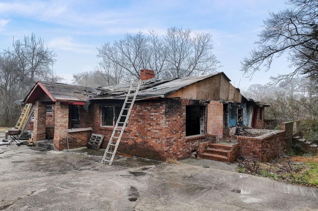 2636 Old Toney Road Ellenwood, GA 30294 - Photo 10 of 16 a view of a house with backyard and chairs