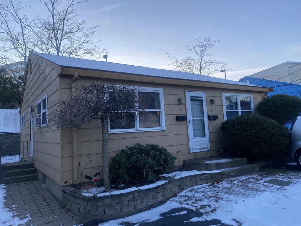 a view of a house with a yard and plants