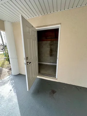 a view of a yard with wooden fence