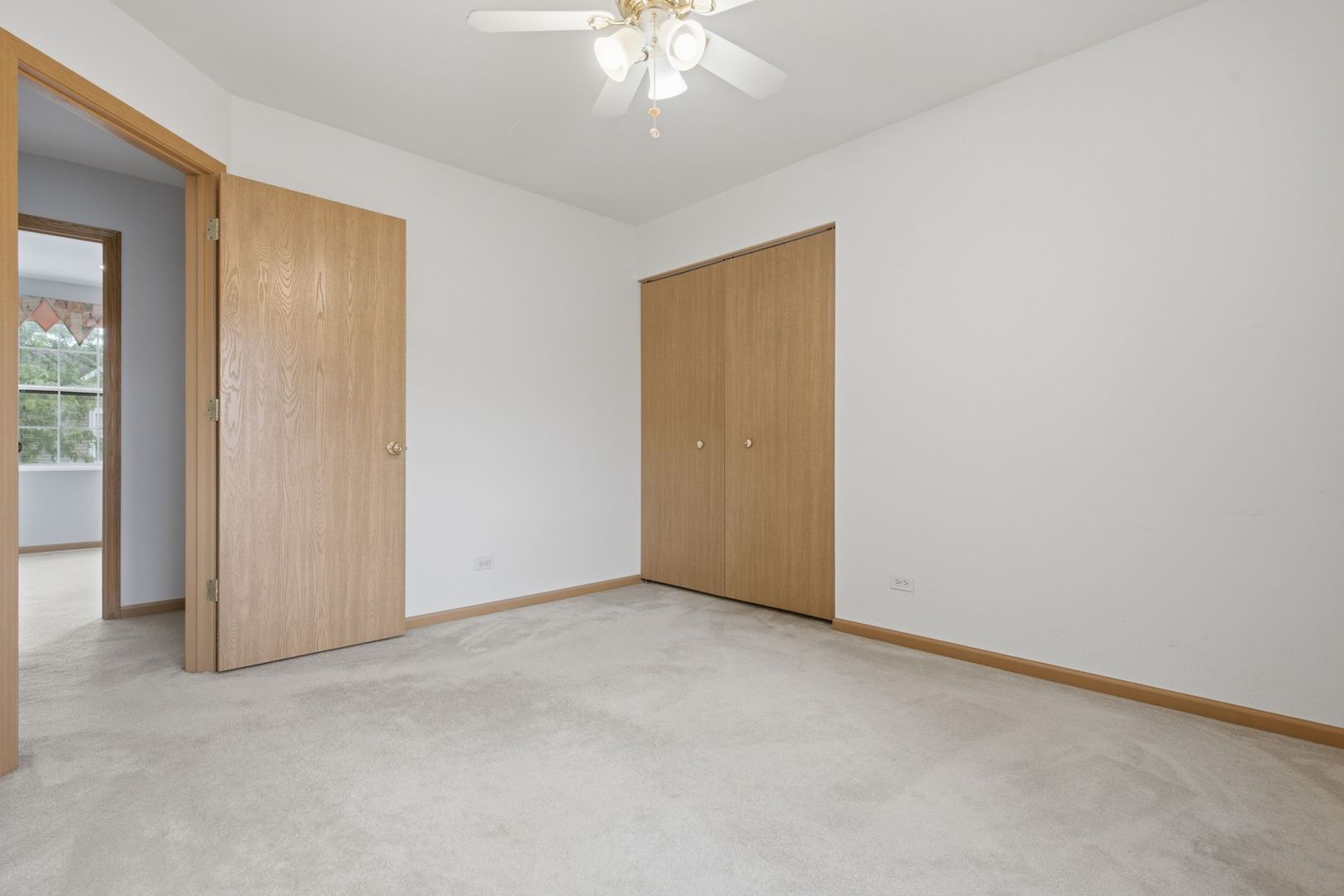 1758 Edith Lane Aurora, IL 60504 - Photo 10 of 28 an empty room with a chandelier fan