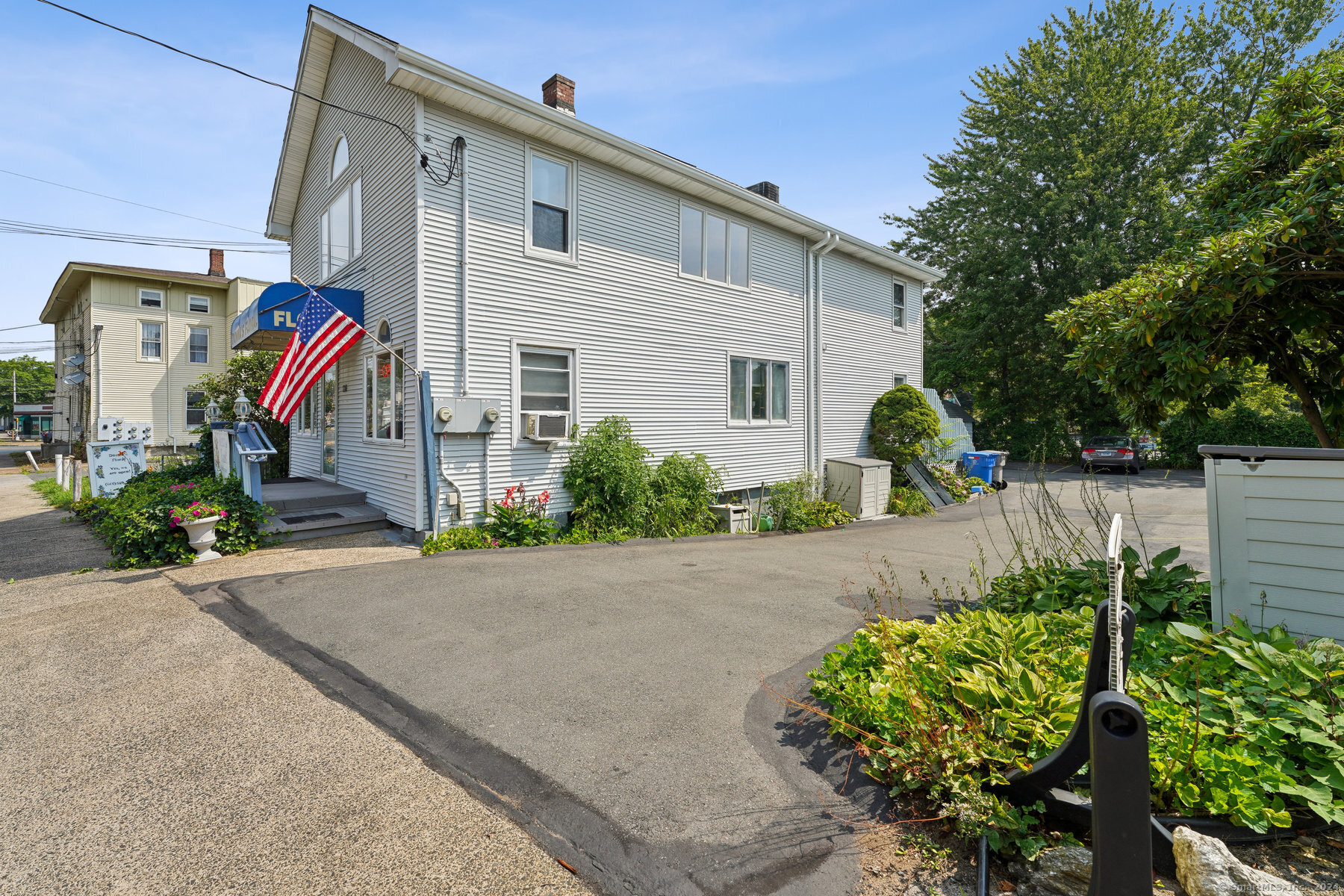 a front view of a house with garden