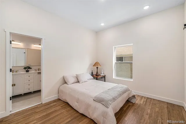 a bedroom with a bed and a dresser