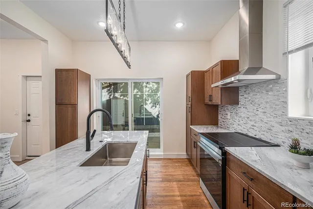 a kitchen with a refrigerator and a sink