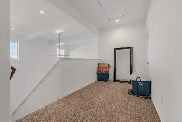 a view of a storage & utility room with refrigerator