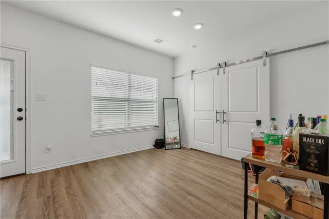 a view of workspace with wooden floor